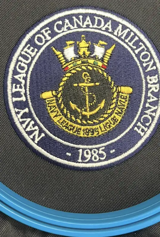 Circular navy and gold embroidered badge