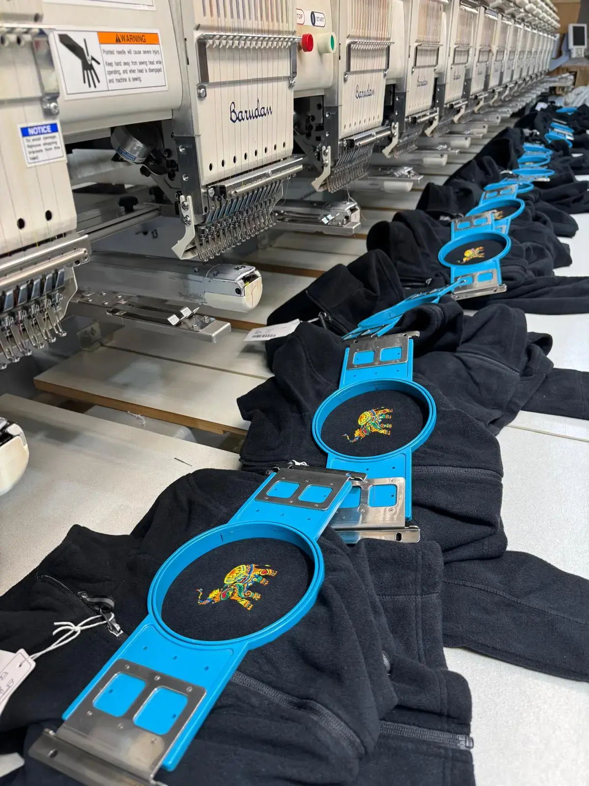 Batch of black caps prepared for custom embroidery