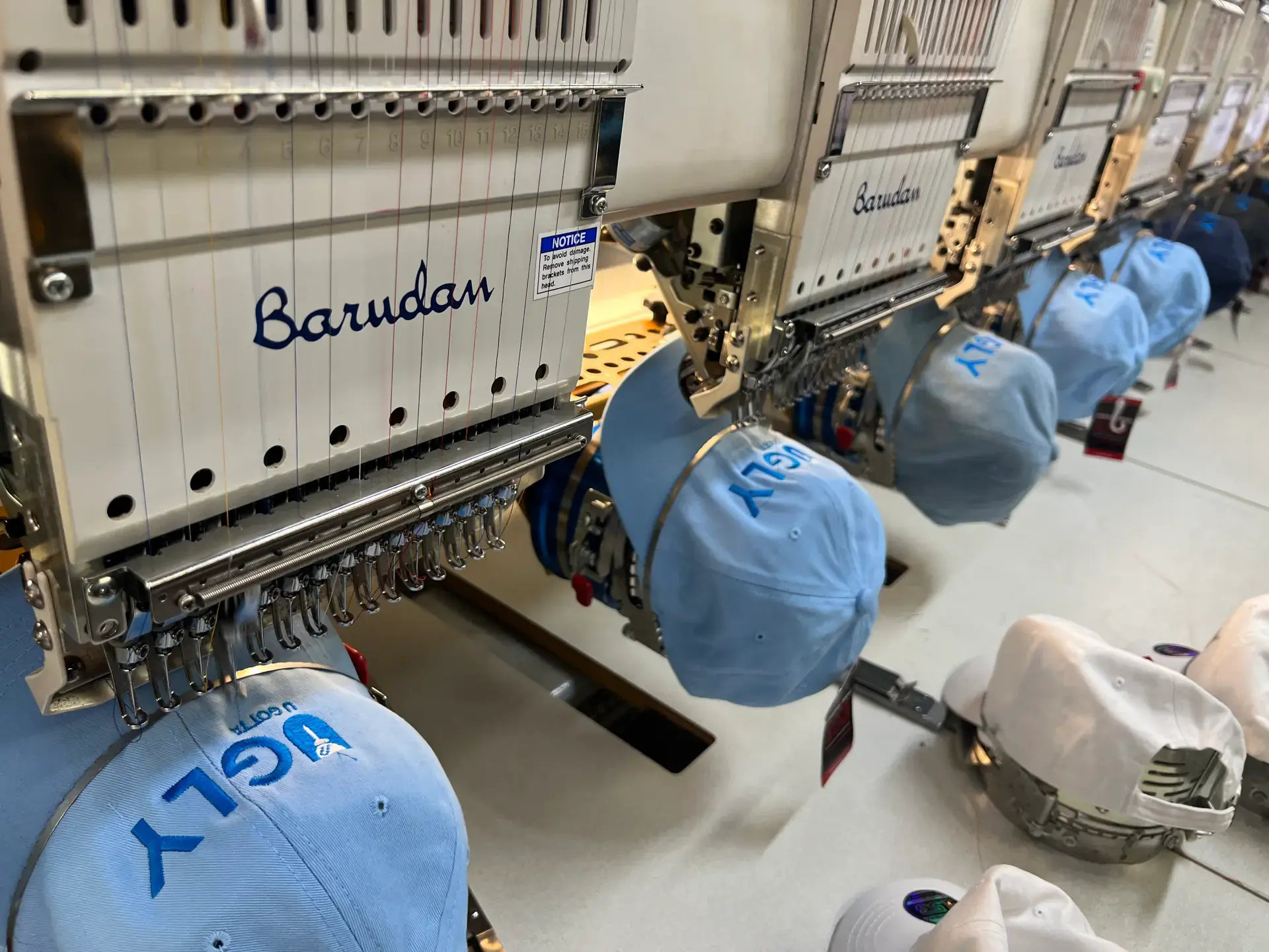 6iX Embroidery production floor with multiple machines in use